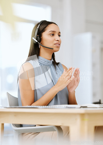 Image of Call center agent, sales advisor and telemarketing employee listening to a client giving them their payment data. Call centre professional giving customer support services about us at her help desk