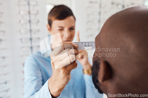 Image of Optometrist, doctor and specialist checking vision retina measurement and sight of a patient with optical PD ruler during eye test in a clinic. Eye doctor giving treatment for prescription glasses