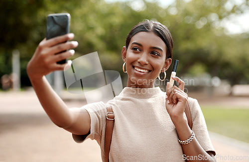 Image of Phone selfie of fashion, style and beauty vlogger smiling for social media content in a park. Wellness, glamour and lifestyle influencer marketing makeup while looking elegant and trendy outdoors