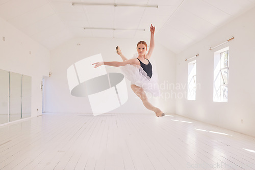 Image of Ballet dancing and jumping practicing in a dance studio or class preparing for a performance. Young elegant dancer, performer or ballerina in the air performing and leaping high