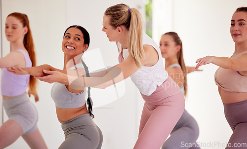 Image of Yoga instructor, group training and pilates class for women in fitness, exercise and training studio. Yogi helping correct body form, posture and warrior pose for healthy lifestyle and flexible body