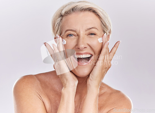 Image of Beauty, skincare and wellness with a senior woman excited about health and motivation for sunscreen, face serum and skin care. Studio portrait of a happy model clean after a shower, happy and healthy