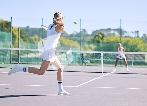 Image of Fitness, balance and sport with woman tennis players practice competitive match at a sport court. Professional athlete workout at a game or competition. Lady training sports together with partner