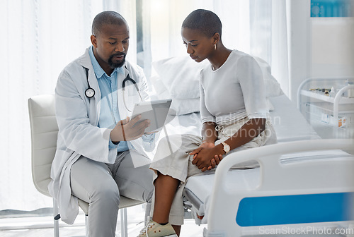 Image of Doctor consulting patient with digital tablet, discussing diagnosis and medical checkup in hospital. Healthcare worker and trusted physician in appointment with medicine advice, wellness and feedback