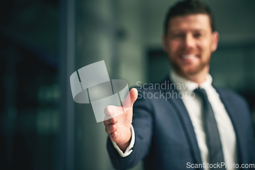 Image of Professional corporate businessman about to give a handshake as a greeting or agreement after negotiations on a deal, partnership or merger. Executive male offering formal gesture at business meeting