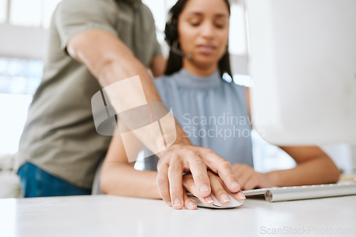 Image of Sexual harassment or abuse by a business man of a female employee by putting his hand on hers. Unhappy and scared female coworker feeling uncomfortable due to inappropriate touching in the office