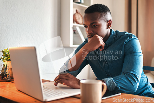 Image of Man thinking, typing and working on a laptop remote for a social media startup content writing business. Planning, focused and serious freelancer, writer or author reading and reviewing an article