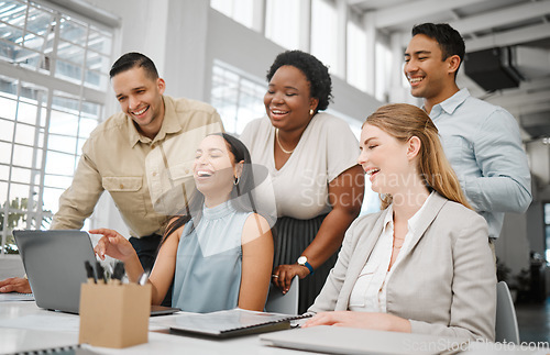 Image of Cheerful, joyful professional business people looking at laptop, browsing funny videos online and bonding on break in office at work. Corporate, diverse and young colleagues searching the internet