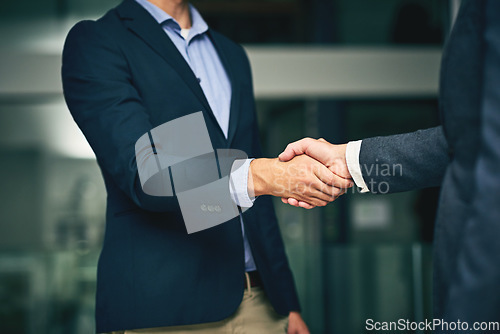 Image of Closeup of businesswomen shaking hands during a meeting in an office. Colleagues finalizing a successful promotion, deal and merger. Coworkers greet, collaborate and negotiate during job interview