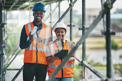 Image of Construction, building and civil engineering team or on site workers with a tablet and plans. Portrait of contractors working as a team feeling happy and ready to engineer and build in the city