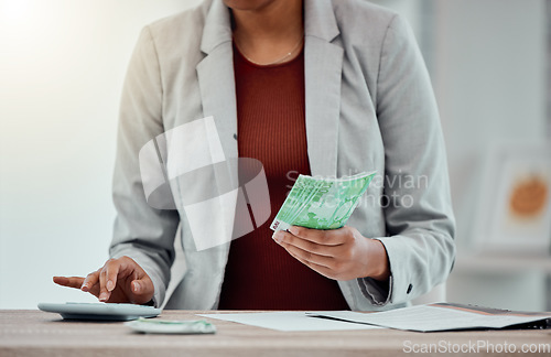 Image of Banking, accounting and finance with an insurance broker or moneychanger typing on a calculator, comparing currency and exchange rates. Closeup of a business woman holding cash, money or bank notes