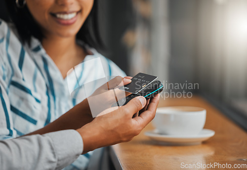 Image of Hands paying bill with credit card payment for coffee or tea at cafe, coffee shop or restaurant close up. Woman making cashless purchase with help and assistance from store worker, employee or waiter