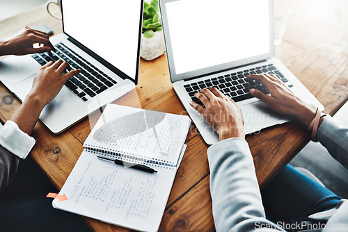 Image of Colleagues, employees and team doing proposal, planning and searching for ideas on the internet. Business people working on laptop, writing notes in book and typing emails together at work from above