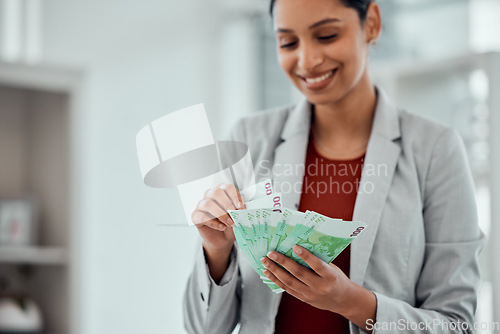 Image of Financial growth, retirement saving and holding money notes by a young female with cash indoors. Bank notes showing growing investment, banking capital and finance budget of a happy woman accountant