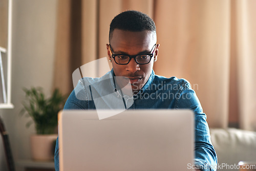 Image of Freelance blogger typing on laptop, thinking of blog post or planning off story vision while working from home living room. Serious, ambitious or inspired writer or entrepreneur working on technology