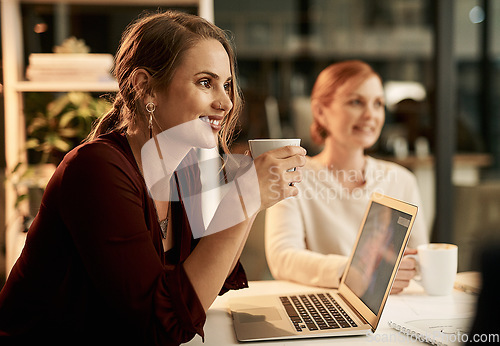 Image of Young, happy and smiling female students enjoying a cup of coffee in a cafe or restaurant while working late at night. .Team of university learners doing research for a college project or assignment