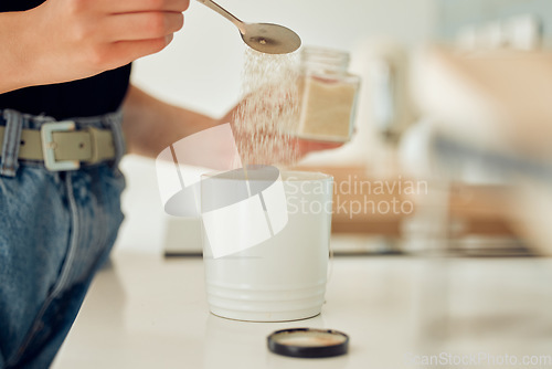 Image of Diabetes, overuse of sugar and unhealthy sweets for mug of tea, coffee or hot drink at home. Closeup of woman making, drinking and preparing beverage with teaspoon of substitute, glucose or stevia