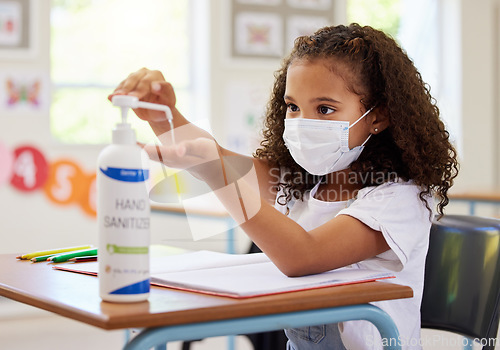 Image of .... School kid using hand sanitizer for germ protection, hygiene and disinfection during covid protocol regulations in a classroom. Young student cleaning hands for safety of flu, corona and virus.