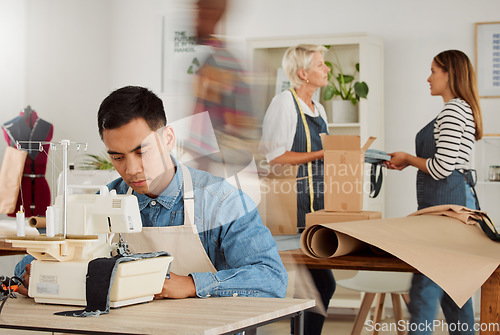 Image of Man working in fashion design shop, making unique clothing and doing tailor job at a factory, boutique or studio at work. Serious male designer, stylist or employee designing clothes with equipment