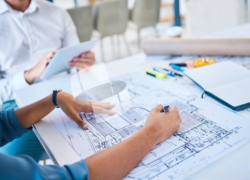 Image of Architect sketching, designing blueprint or doing architecture, engineering or structure drawing on paper at a work studio with hands closeup. Business person working on a design project development