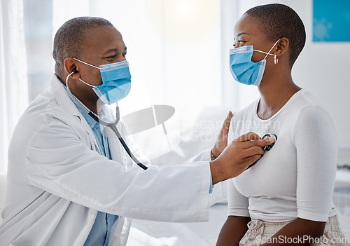 Image of Healthcare, insurance and compliance with covid regulations during a consultation with a doctor and patient. Health care professional doing a checkup with a stethoscope on a young, happy woman