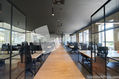 Image of In a setting of modern, glass-walled business startup offices, the open, airy workspace reflects a contemporary and innovative ambiance, promising a dynamic environment for entrepreneurial growth