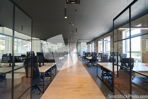 Image of In a setting of modern, glass-walled business startup offices, the open, airy workspace reflects a contemporary and innovative ambiance, promising a dynamic environment for entrepreneurial growth