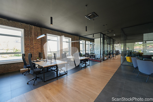 Image of In a setting of modern, glass-walled business startup offices, the open, airy workspace reflects a contemporary and innovative ambiance, promising a dynamic environment for entrepreneurial growth