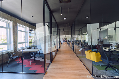 Image of In a setting of modern, glass-walled business startup offices, the open, airy workspace reflects a contemporary and innovative ambiance, promising a dynamic environment for entrepreneurial growth