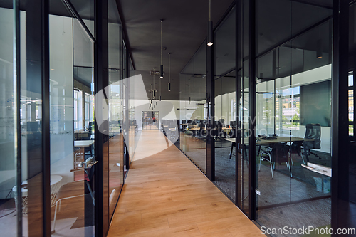 Image of In a setting of modern, glass-walled business startup offices, the open, airy workspace reflects a contemporary and innovative ambiance, promising a dynamic environment for entrepreneurial growth