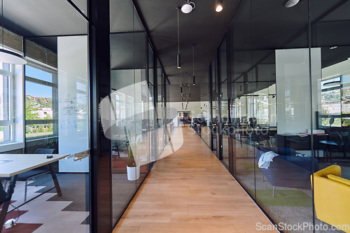 Image of In a setting of modern, glass-walled business startup offices, the open, airy workspace reflects a contemporary and innovative ambiance, promising a dynamic environment for entrepreneurial growth