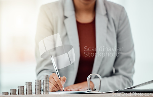 Image of Bank, coins and hands writing in tax files for financial year or consulting at work desk. Economy, money and accountant working on corporate documents and administration for management.