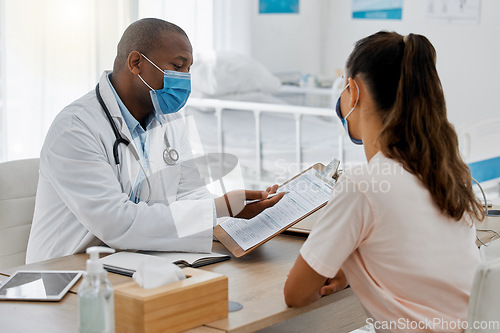 Image of Health insurance, compliance and medical admin in covid pandemic, doctor consulting with patient in office. Healthcare professional helping a woman, discussing plan while signing permission form
