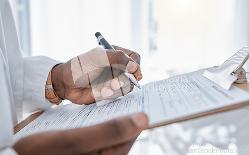 Image of Doctor writing survey, insurance and claim form for medical paperwork, document and script for patient records, test result and research in a hospital. Physician hands signing and planning healthcare