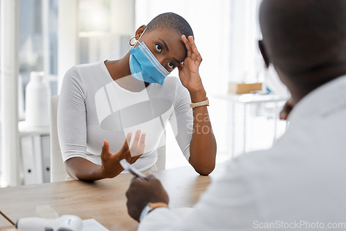 Image of Stressed, post covid or sick patient at a doctor appointment due to covid symptoms and headache. Covid19 fatigue and unhealthy woman talking to healthcare or medical worker about at a hospital