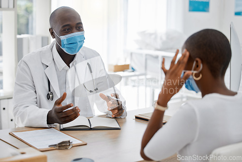 Image of Doctor appointment by a woman with a headache or covid symptoms consulting a healthcare professional at the hospital. Black male medical worker or GP has a consultation with an ill or sick patient