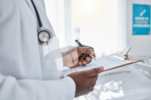 Image of Medical, insurance and doctor filling out patient history for diagnosis at the hospital. Healthcare professional working on clipboard with paper, consulting and writing health paperwork at a clinic.