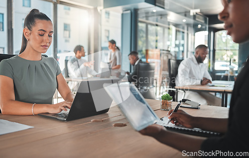 Image of Business workers, teamwork and working on a laptop, tablet or technology together. Corporate businesspeople in office, collaboration and planning or strategy research in a modern office.