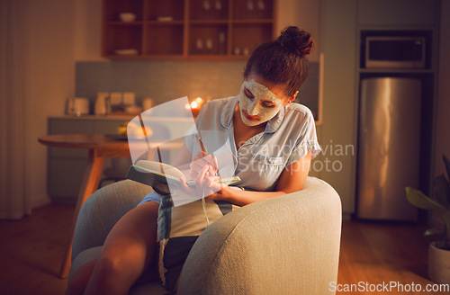 Image of Selfcare, grooming and creative writing by a woman making notes in diary while giving herself a facial. Relaxed female planning ideas for a novel in a journal, enjoying free time and a calming hobby