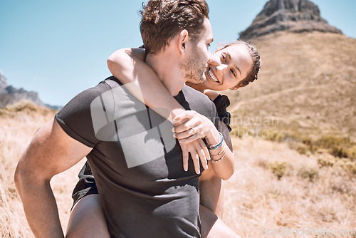 Image of Piggyback, happy and in love couple having fun, being active and enjoying quality time together outdoors. Cute, sweet and loving boyfriend and girlfriend bonding on an adventurous and cheerful date