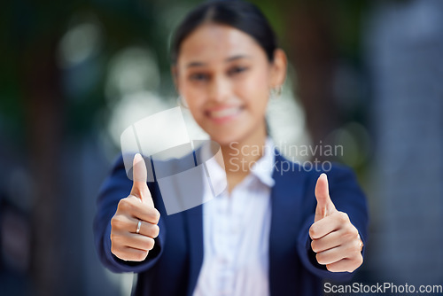 Image of Thumbs up, blurred and working woman does agree by doing hand gesture to express she is happy. Employee likes and smiles about good news about reaching best professional career goal at work.