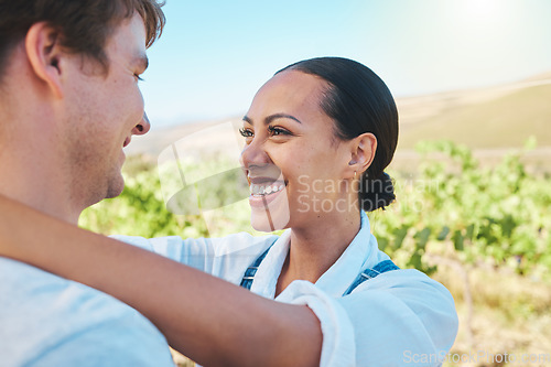 Image of Love, countryside and couple smile, loving and bond together on a sunny wine farm field and nature agriculture. Interracial, green and happy man and woman travel to a holiday vacation trip in summer