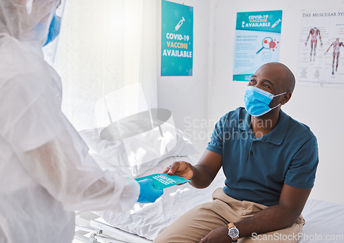 Image of Medical doctor giving brochure to man with covid, wearing mask and getting healthcare wellness advice. Expert, professional or medicine worker consulting with patient and giving marketing insurance