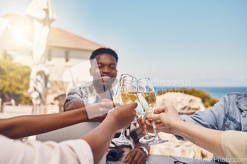 Image of Celebration, alcohol and friends toast with wine at an outdoor restaurant, happy and having fun. Young diverse people gathering to celebrate freedom, birthday, friendship or good news with cheers