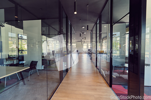 Image of In a setting of modern, glass-walled business startup offices, the open, airy workspace reflects a contemporary and innovative ambiance, promising a dynamic environment for entrepreneurial growth