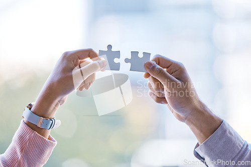 Image of Puzzle, collaboration and teamwork between business people hands after business meeting for partnership, contract or merger. Vision, Innovation and corporate success after team work b2b strategy deal