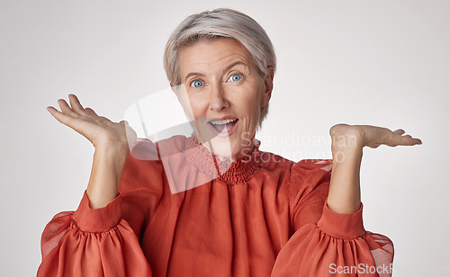 Image of Wow and surprise senior woman with emoji hand gesture or expression on studio grey background. Senior fashion business lady with hands for shocking unbelievable pension deal, discount or sale