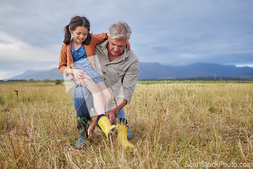 Image of Happy family bonding on farm grandparent and girl having fun in nature, prepare for walk together. Smiling child and caring grandfather exploring outdoors, enjoying a walk in the countryside or field