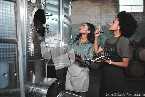 Image of Wine, farming and distillery workers doing quality and sustainability checkup in alcohol manufacturing industry. Farmers or employees in production cellar warehouse or brewing factory business