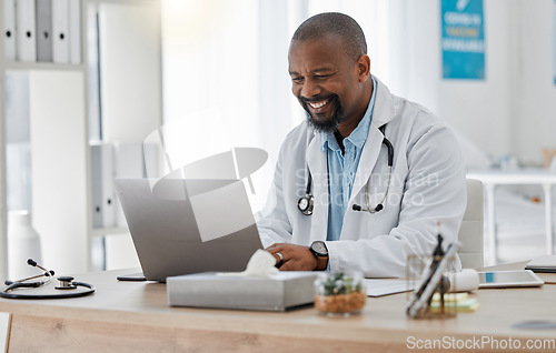 Image of Doctor, medical and healthcare worker on laptop checking history or medical data at hospital or clinic working with tech. GP man on computer reading emails, patient records and documents